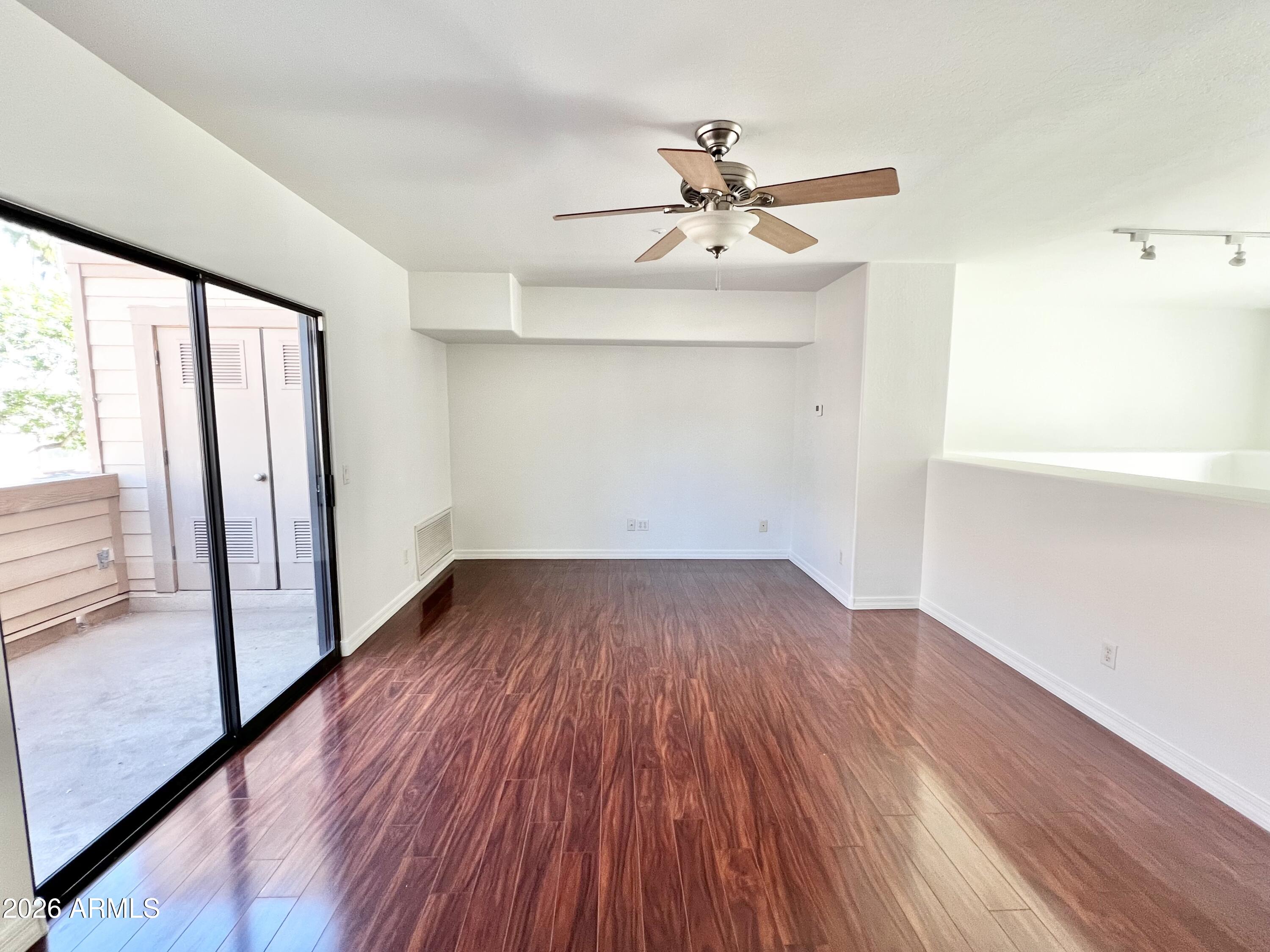 730 South Beck Avenue Tempe, AZ 85281 - Photo 16 of 29 an empty room with wooden floor fan and windows