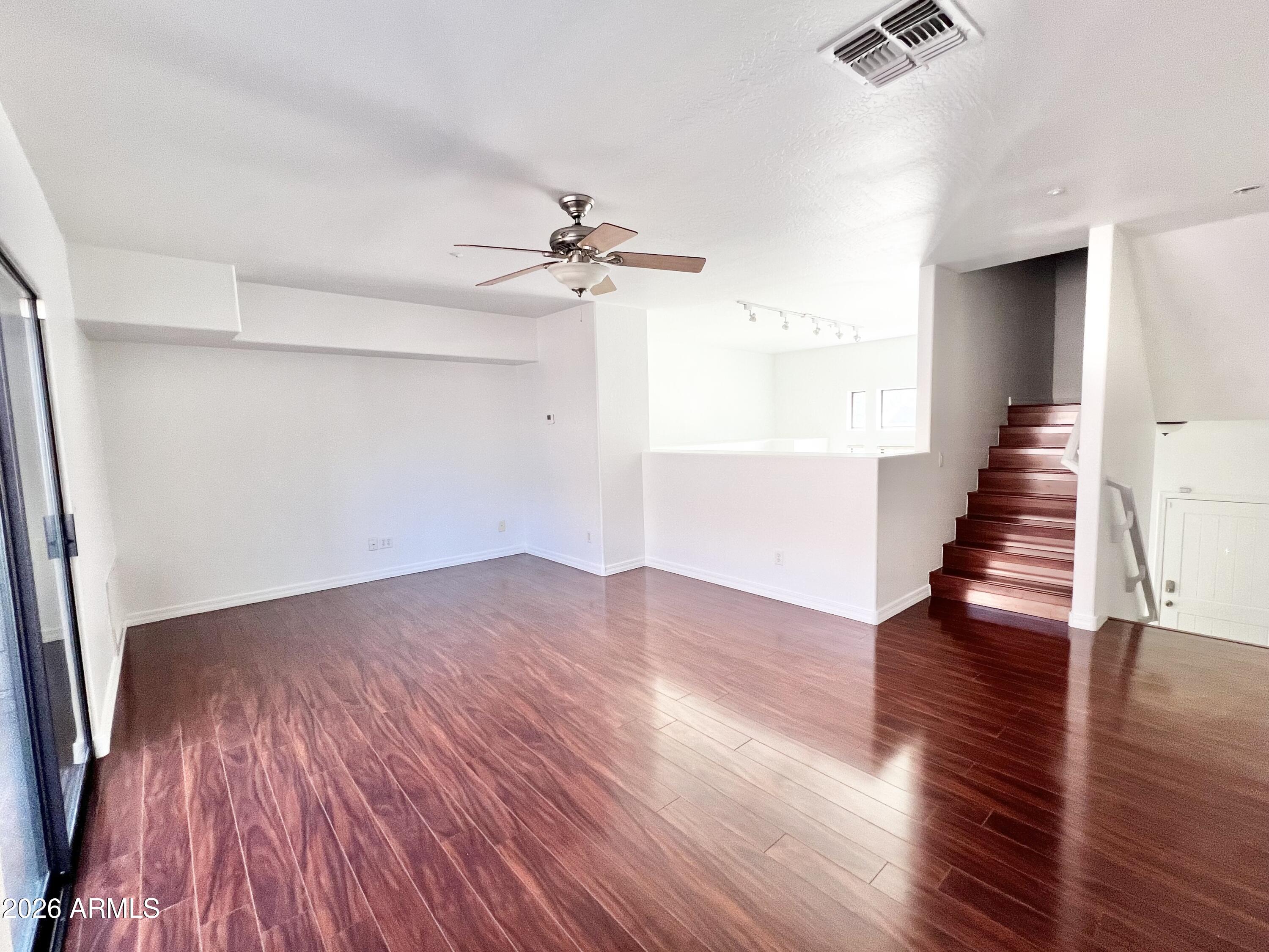 730 South Beck Avenue Tempe, AZ 85281 - Photo 18 of 29 wooden floor in an empty room with a window