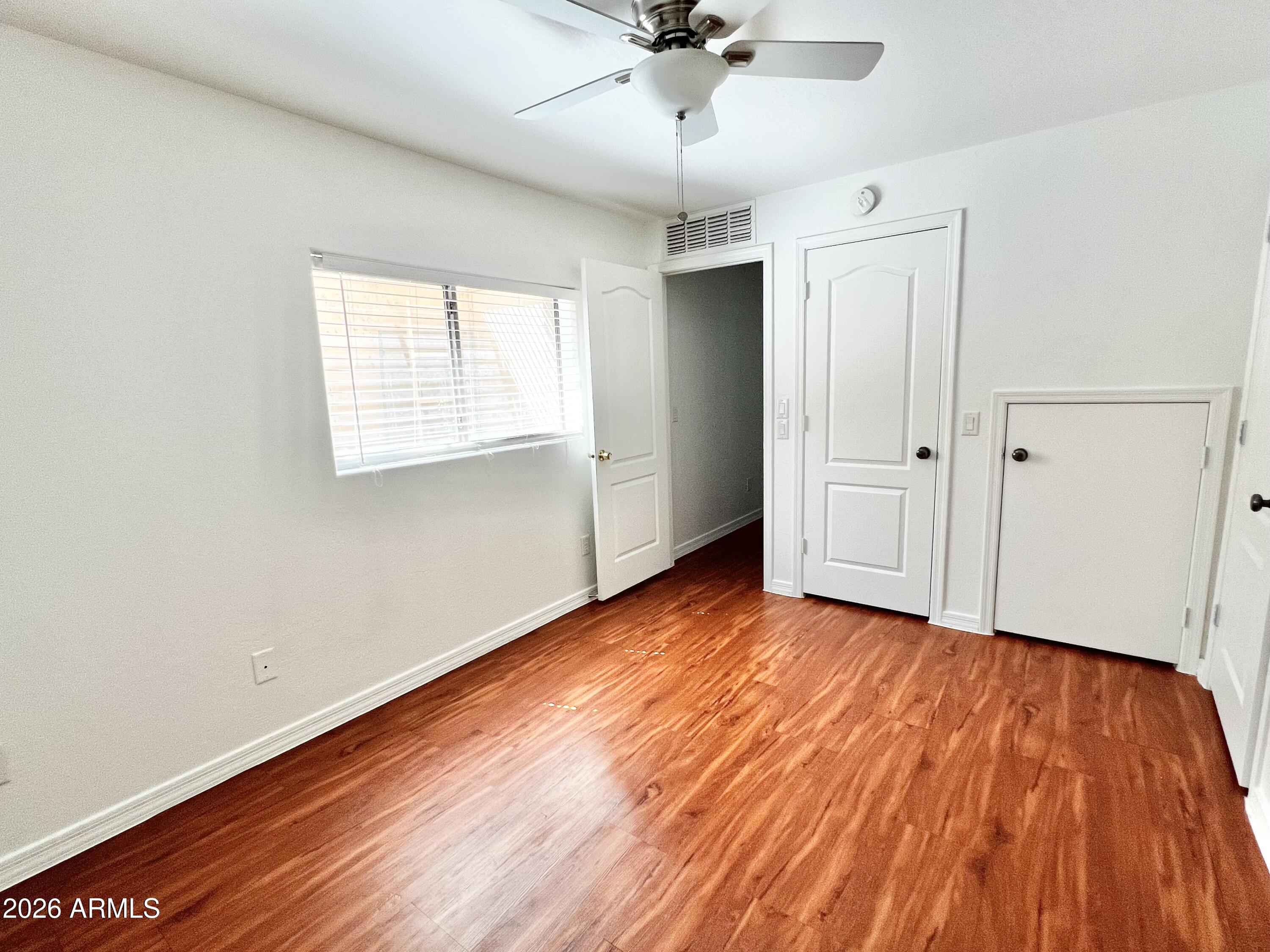 730 South Beck Avenue Tempe, AZ 85281 - Photo 26 of 29 wooden floor in an empty room with a window