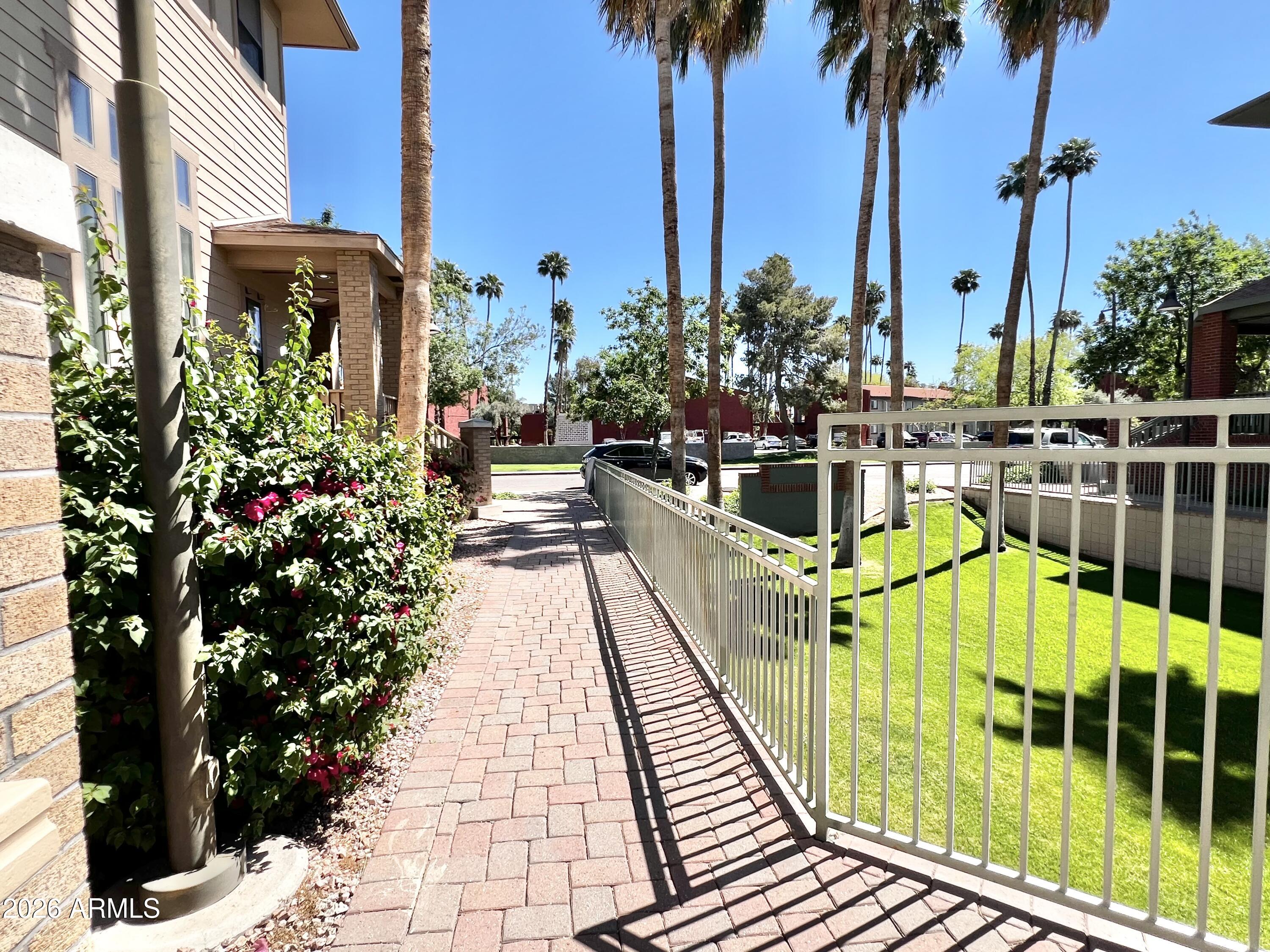 730 South Beck Avenue Tempe, AZ 85281 - Photo 4 of 29 a view of a swimming pool with a table and chairs