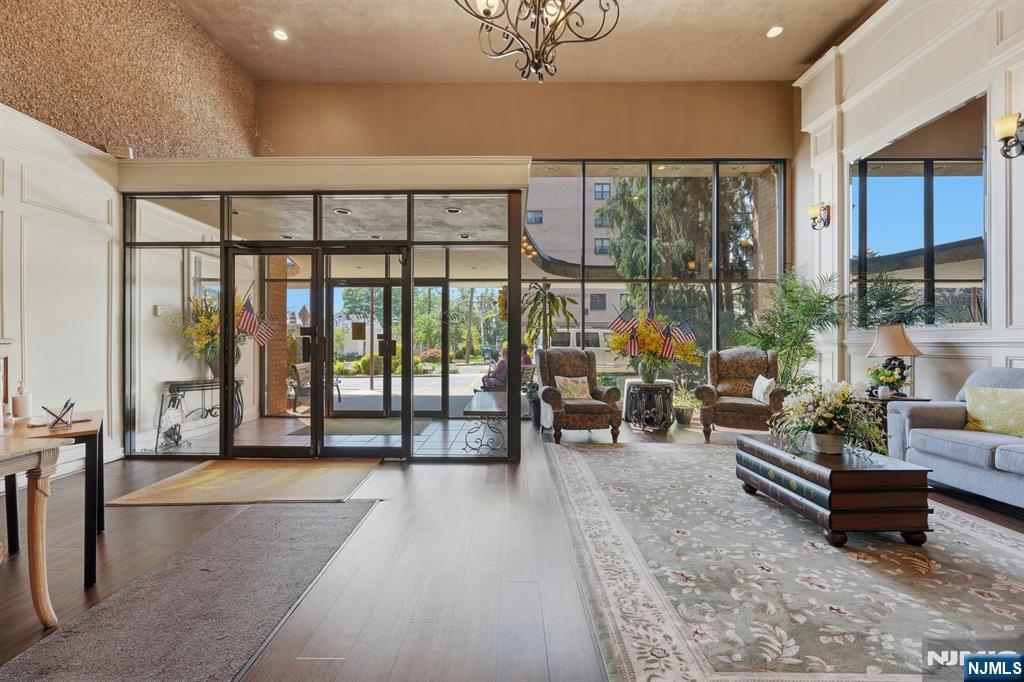 265 Main Street, Unit 704 Ridgefield Park, NJ 07660 - Photo 4 of 23 a lobby with furniture and floor to ceiling window