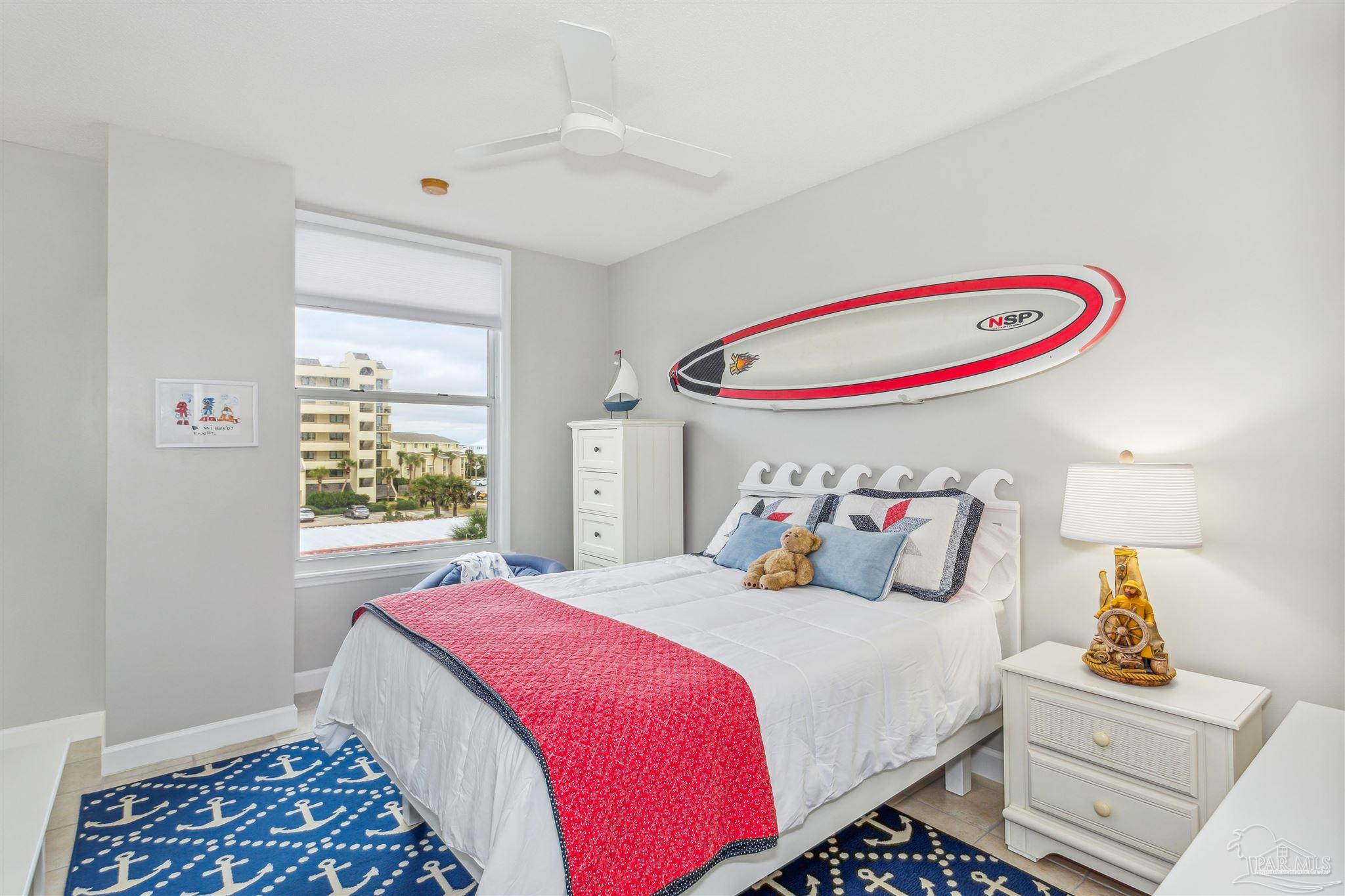800 Fort Pickens Road, Unit 204 Pensacola Beach, FL 32561 - Photo 32 of 45 a bedroom with a bed and a window