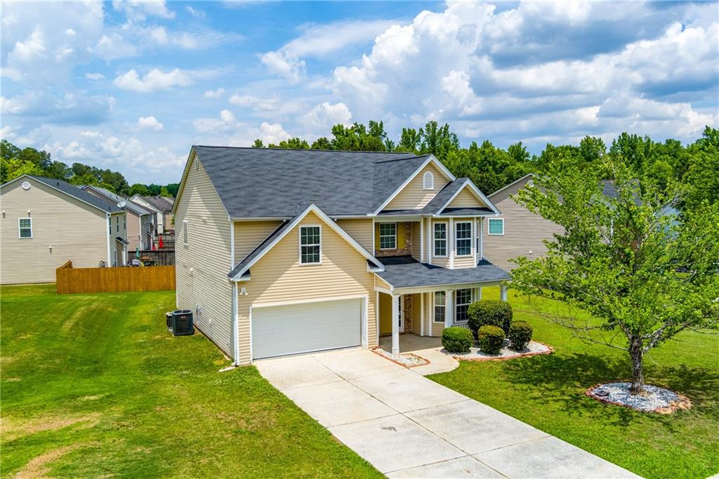 375 Walton View Fairburn, GA 30213 - Photo 31 of 38 a front view of a house with a yard