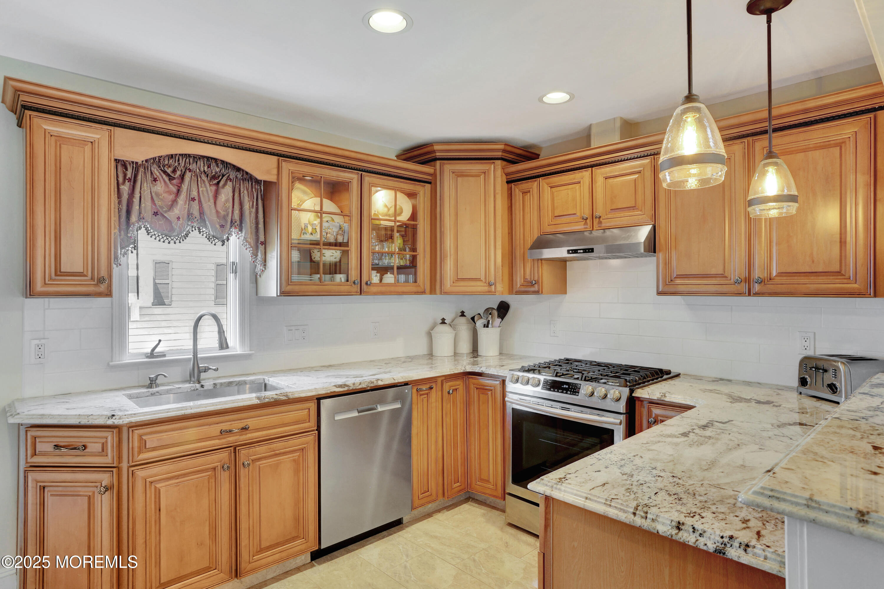 166 Grayson Avenue Hamilton, NJ 08619 - Photo 11 of 31 a kitchen with a sink stove and cabinets