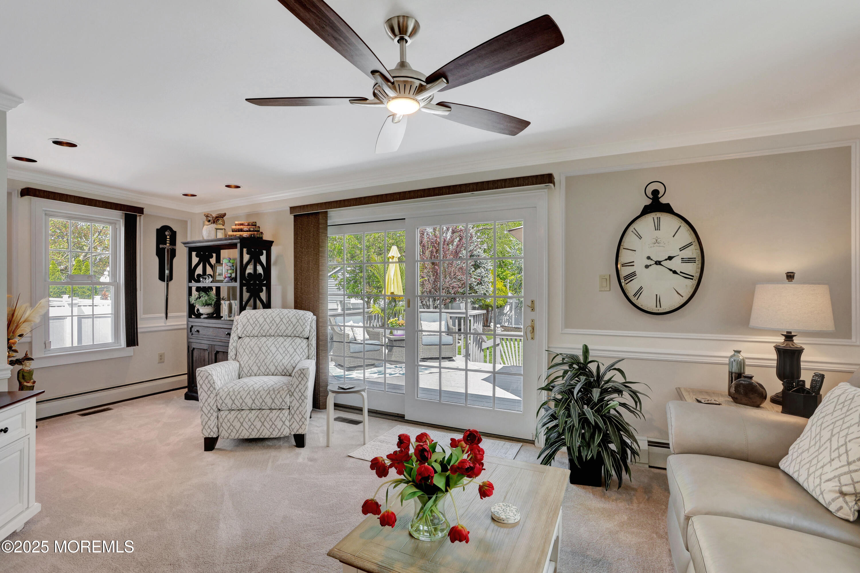 166 Grayson Avenue Hamilton, NJ 08619 - Photo 15 of 31 a living room with furniture a clock and a large window