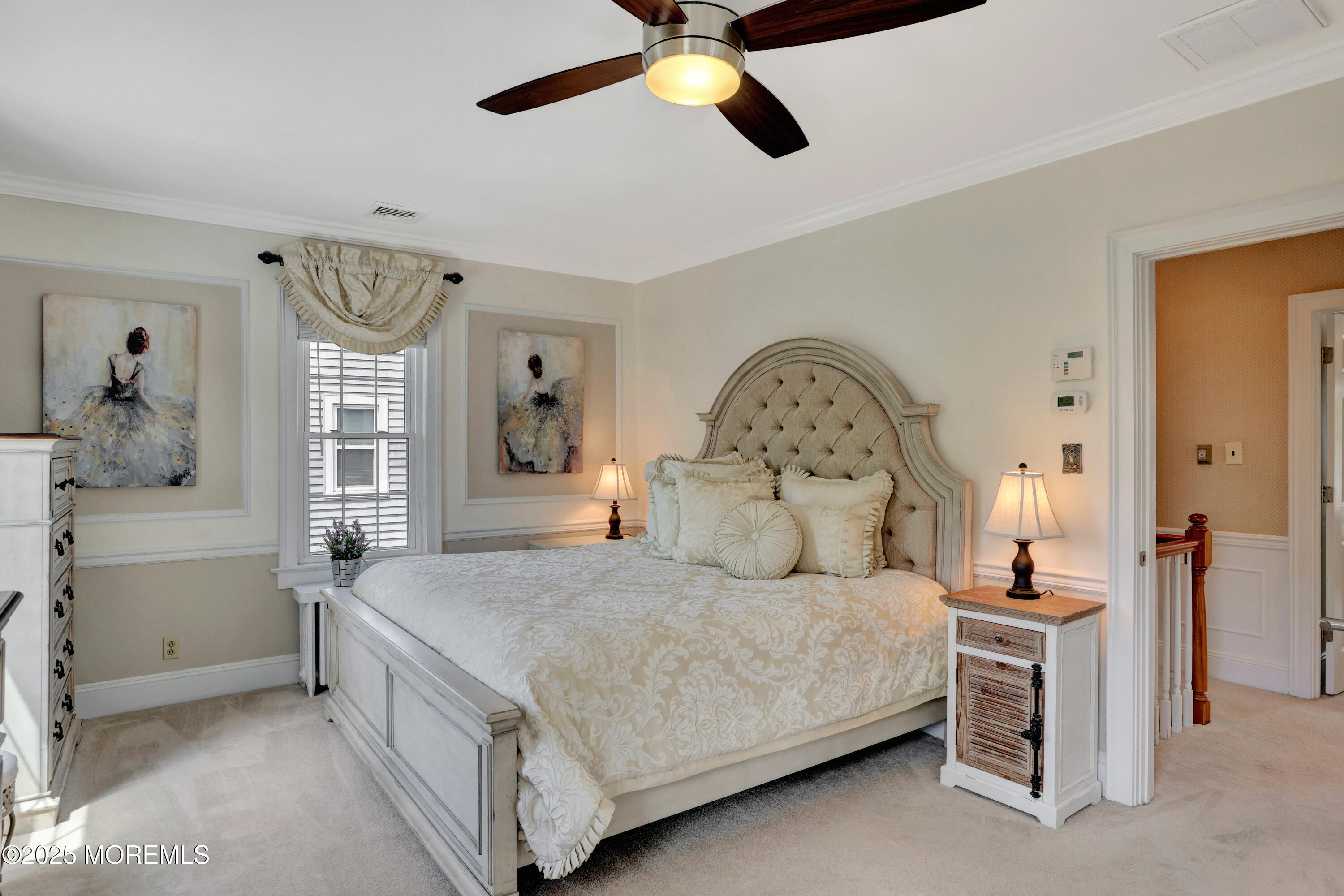 166 Grayson Avenue Hamilton, NJ 08619 - Photo 20 of 31 a bedroom with a large bed and a chandelier
