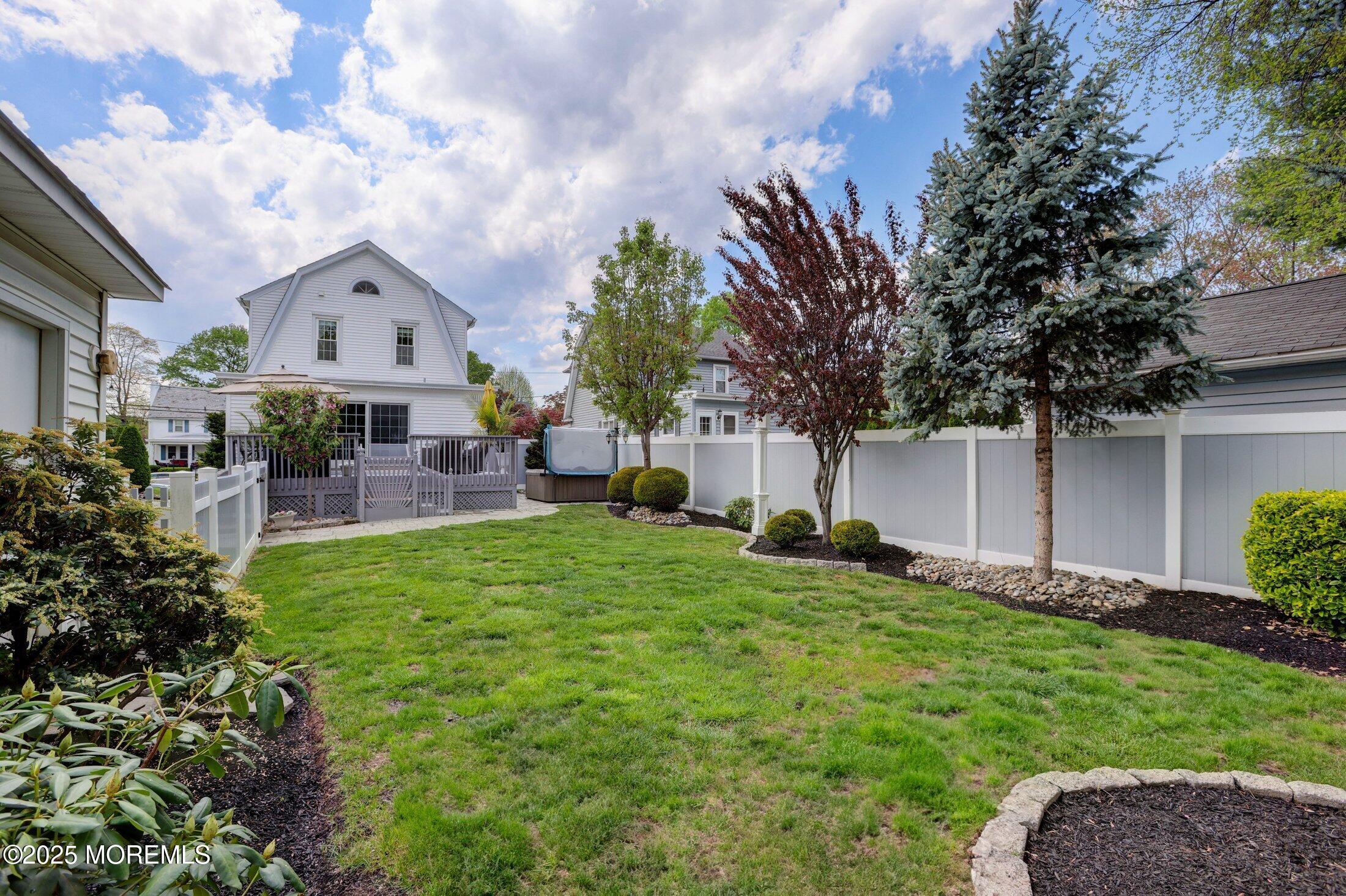 166 Grayson Avenue Hamilton, NJ 08619 - Photo 27 of 31 a front view of a house with a garden and a tree