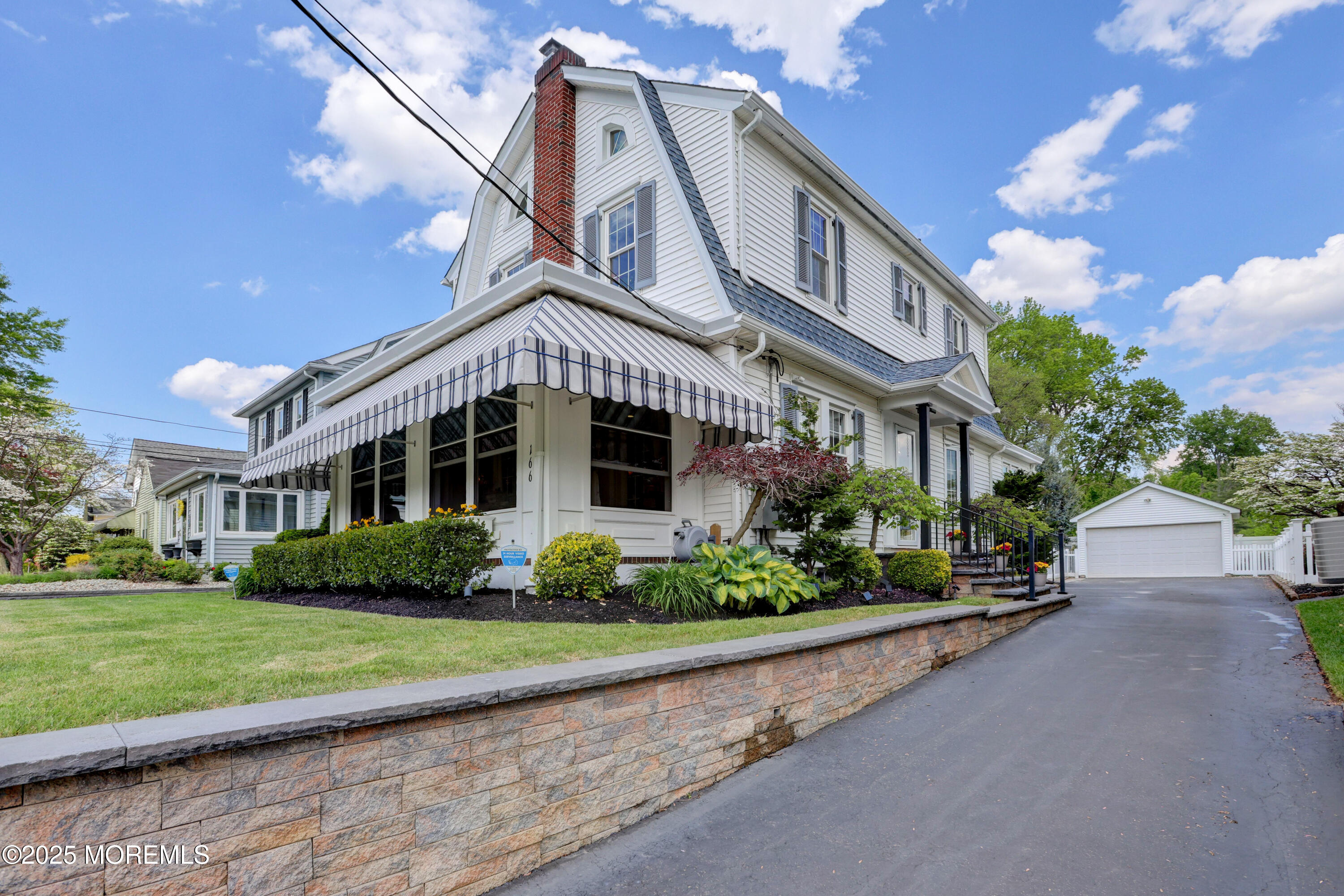 166 Grayson Avenue Hamilton, NJ 08619 - Photo 4 of 31 a front view of a building with a garden