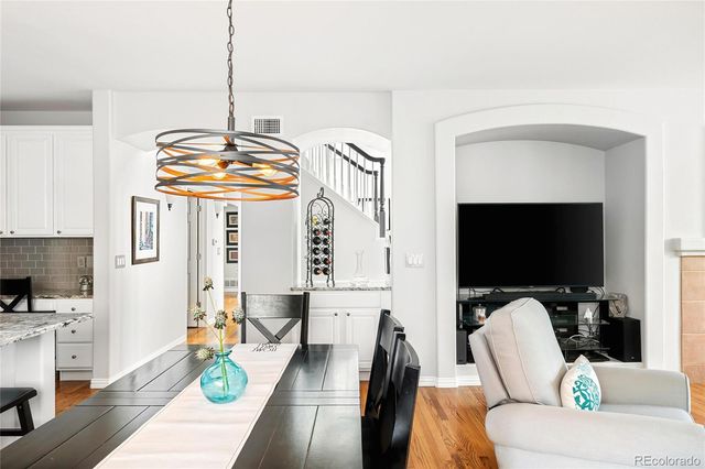 a living room with fireplace furniture and a flat screen tv