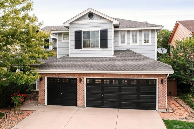 a front view of a house with a garage