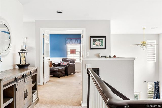 a view of living room with furniture and a window