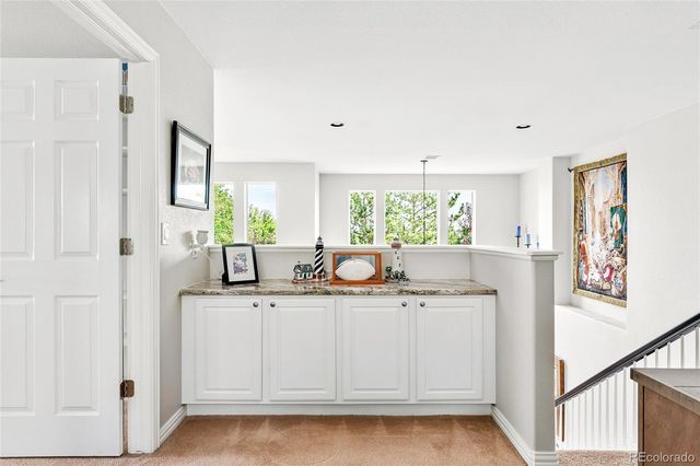 a bathroom with a sink a mirror and a window