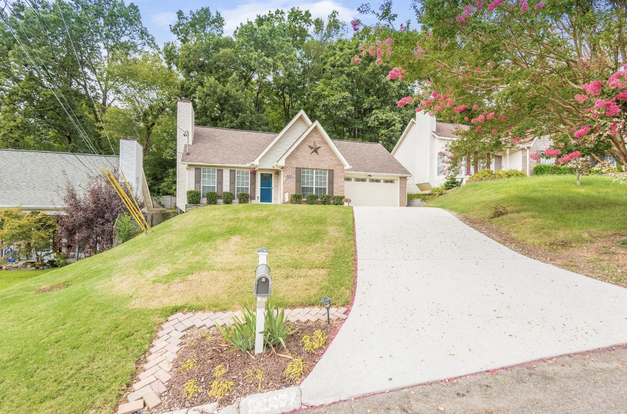 4337 Walnut Ridge Lane Knoxville, TN 37921 - Photo 4 of 24 a front view of a house with garden