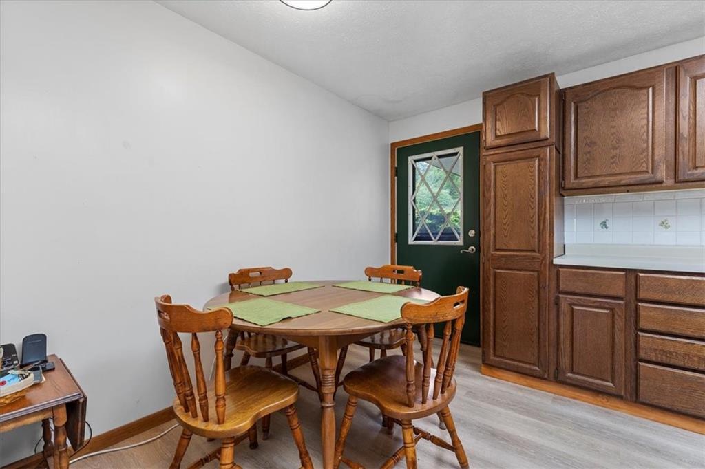 347 Lee Road Burgettstown, PA 15021 - Photo 14 of 48 a dining room with furniture a window and wooden floor