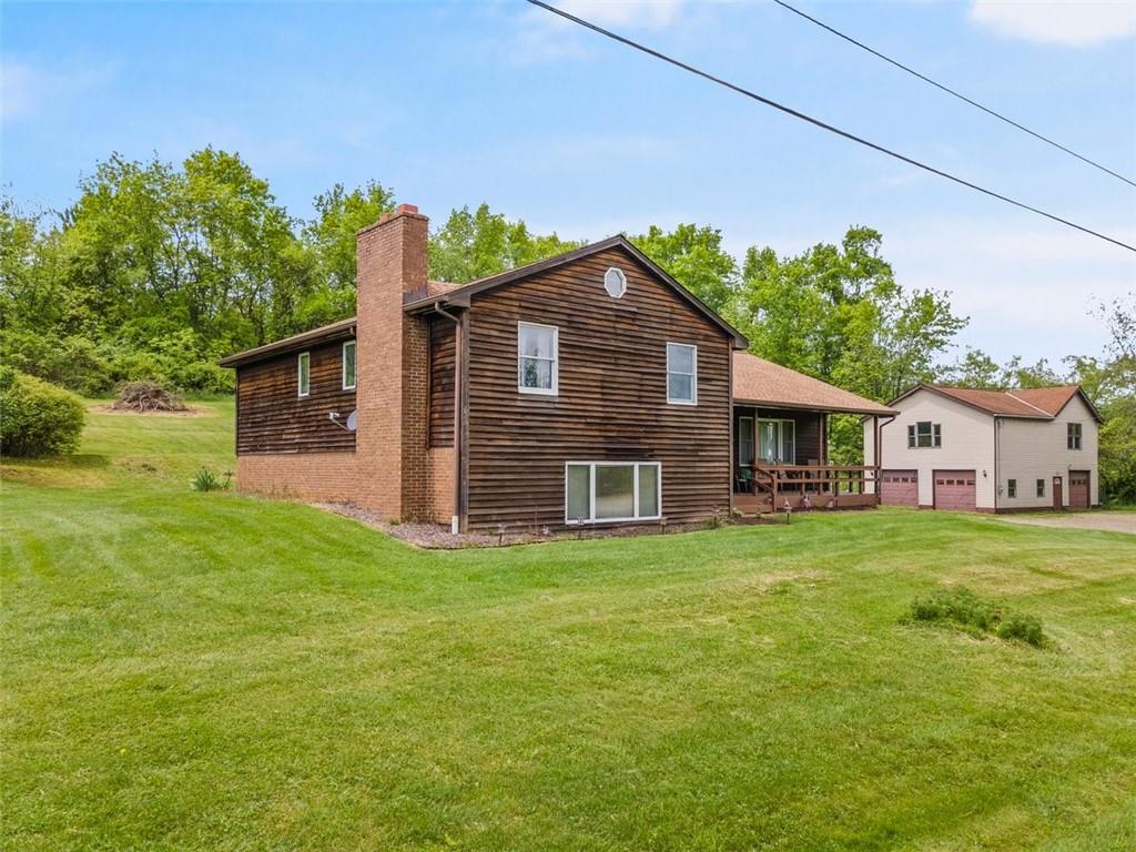 347 Lee Road Burgettstown, PA 15021 - Photo 2 of 48 a big house with a big yard and large trees