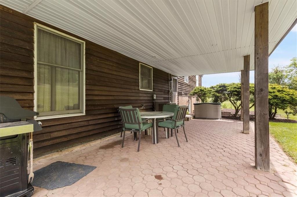 347 Lee Road Burgettstown, PA 15021 - Photo 35 of 48 a patio with table and chairs and potted plants