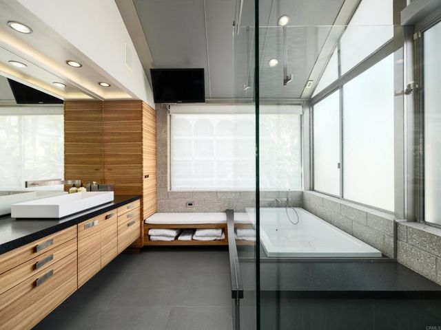 a kitchen with sink cabinets and wooden floor