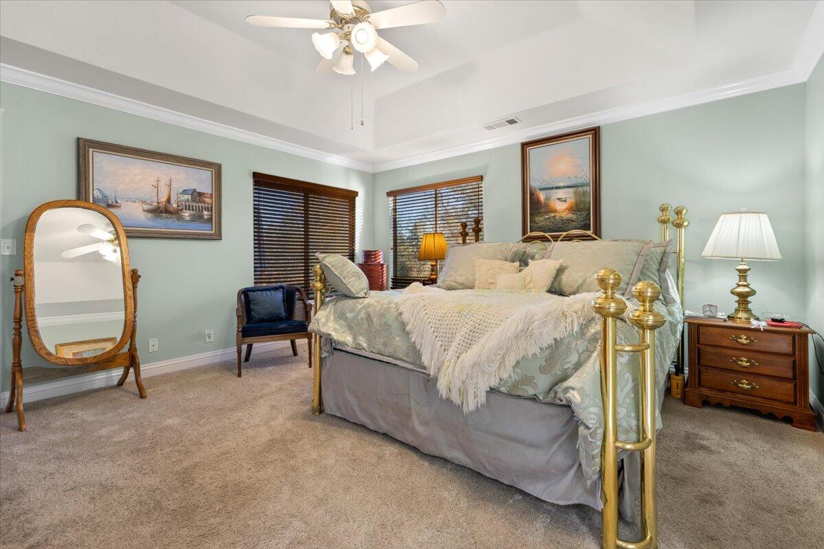 2995 Howard Drive Redding, CA 96001 - Photo 23 of 57 a bedroom with a bed chairs and dresser