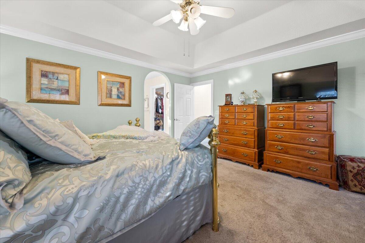 2995 Howard Drive Redding, CA 96001 - Photo 24 of 57 a bedroom with a bed and a flat screen tv