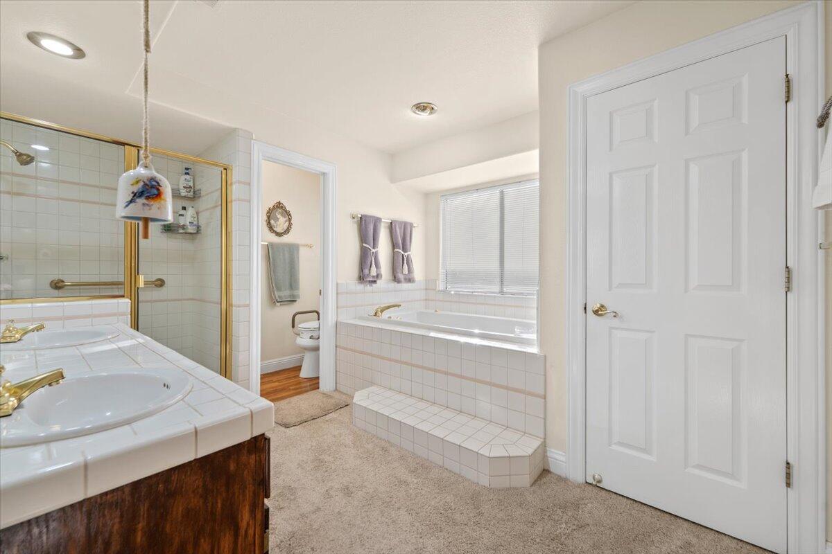 2995 Howard Drive Redding, CA 96001 - Photo 25 of 57 a spacious bathroom with a tub sink and mirror
