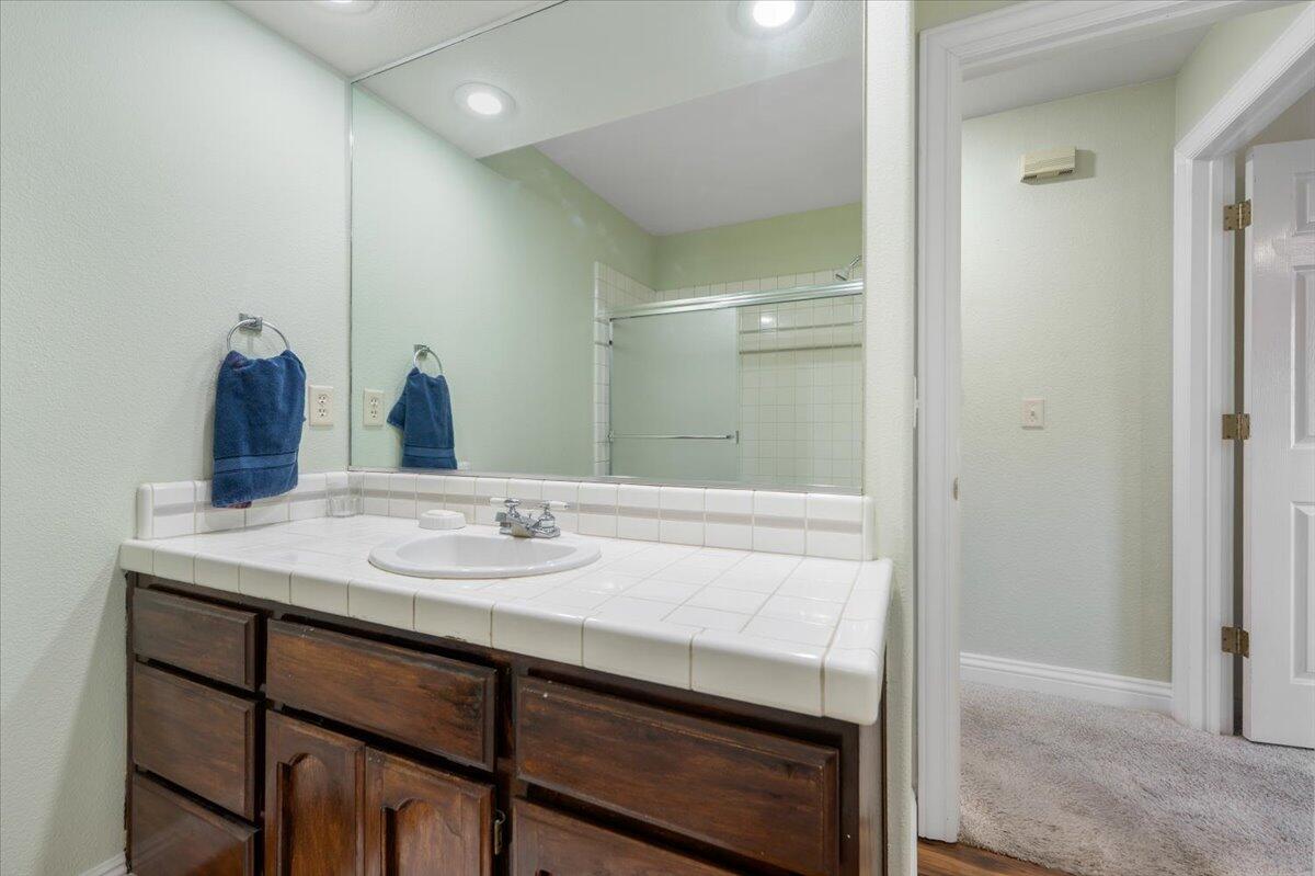 2995 Howard Drive Redding, CA 96001 - Photo 32 of 57 a bathroom with a sink and a mirror