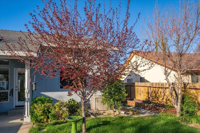 a view of a house with a backyard