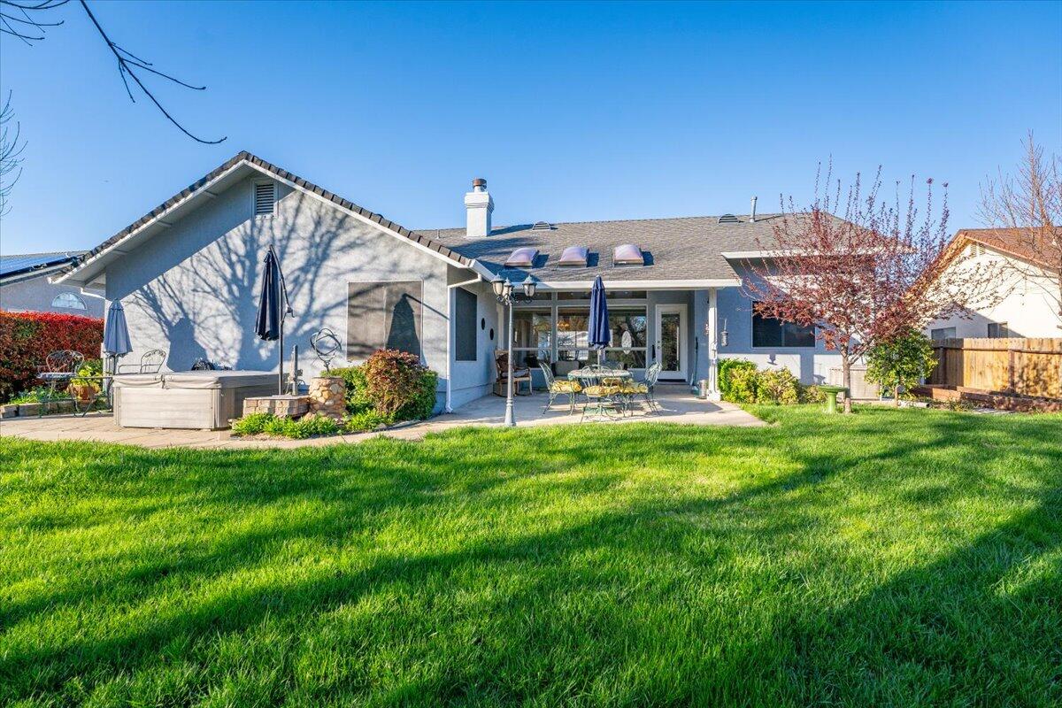 2995 Howard Drive Redding, CA 96001 - Photo 50 of 57 a view of a house with a big yard potted plants and large tree