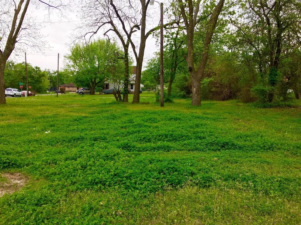 701 West Grove Street Terrell, TX 75160 - Photo 1 of 1 a view of grassy field with benches