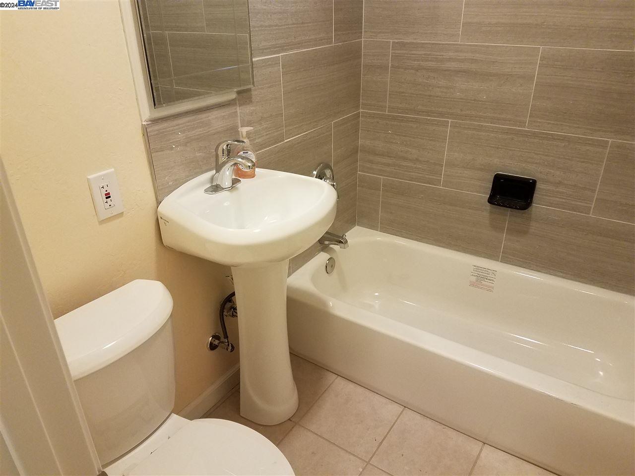 26730 Tyrrell Avenue Hayward, CA 94544 - Photo 17 of 26 a bathroom with a sink a toilet and a bathtub