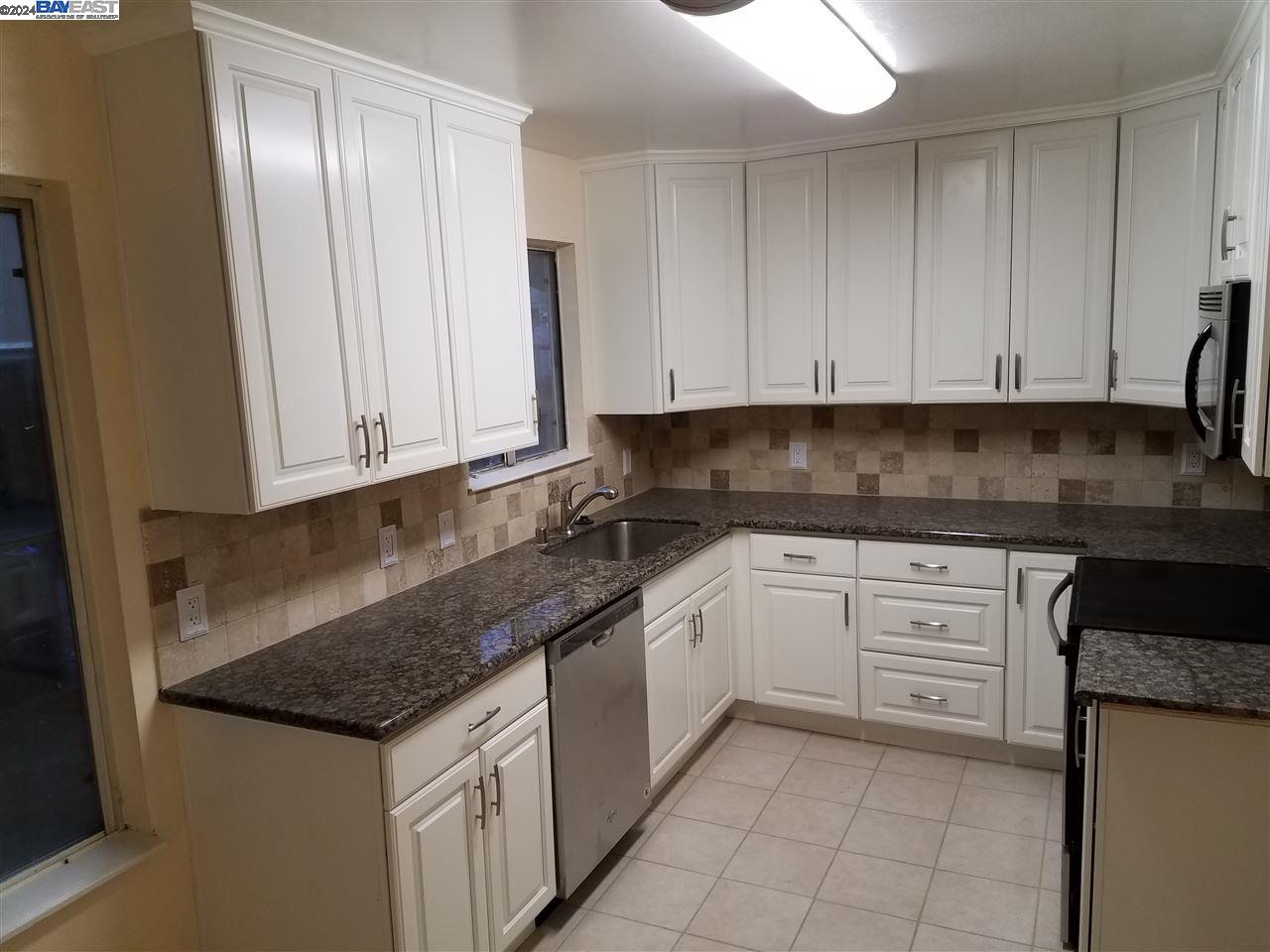 26730 Tyrrell Avenue Hayward, CA 94544 - Photo 2 of 26 a kitchen with granite countertop white cabinets and stainless steel appliances