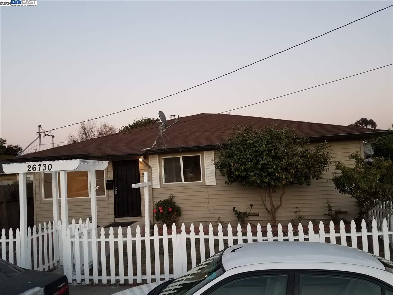 26730 Tyrrell Avenue Hayward, CA 94544 - Photo 22 of 26 a view of a house with a small yard and wooden fence