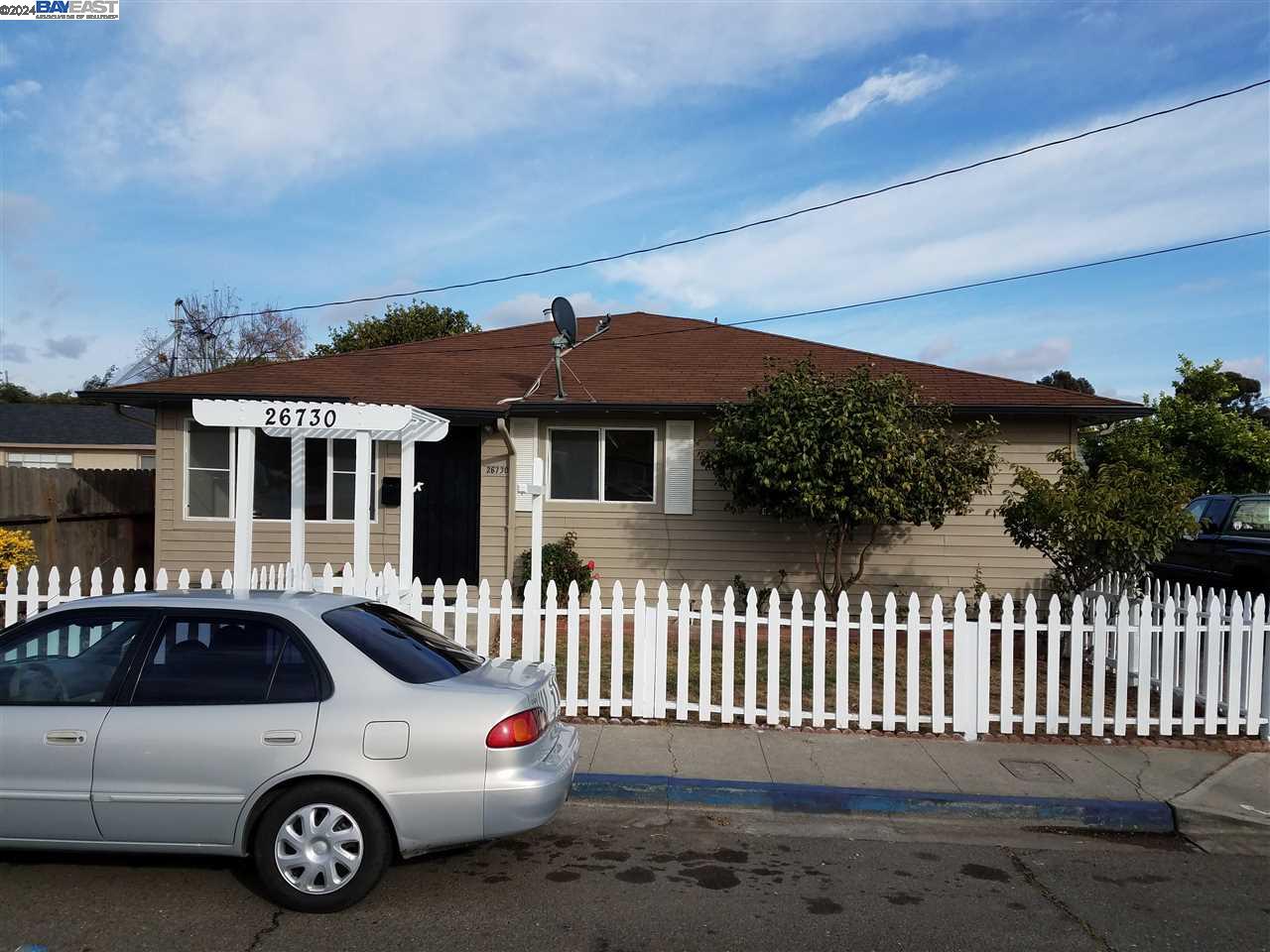 26730 Tyrrell Avenue Hayward, CA 94544 - Photo 23 of 26 a car parked in front of a white house