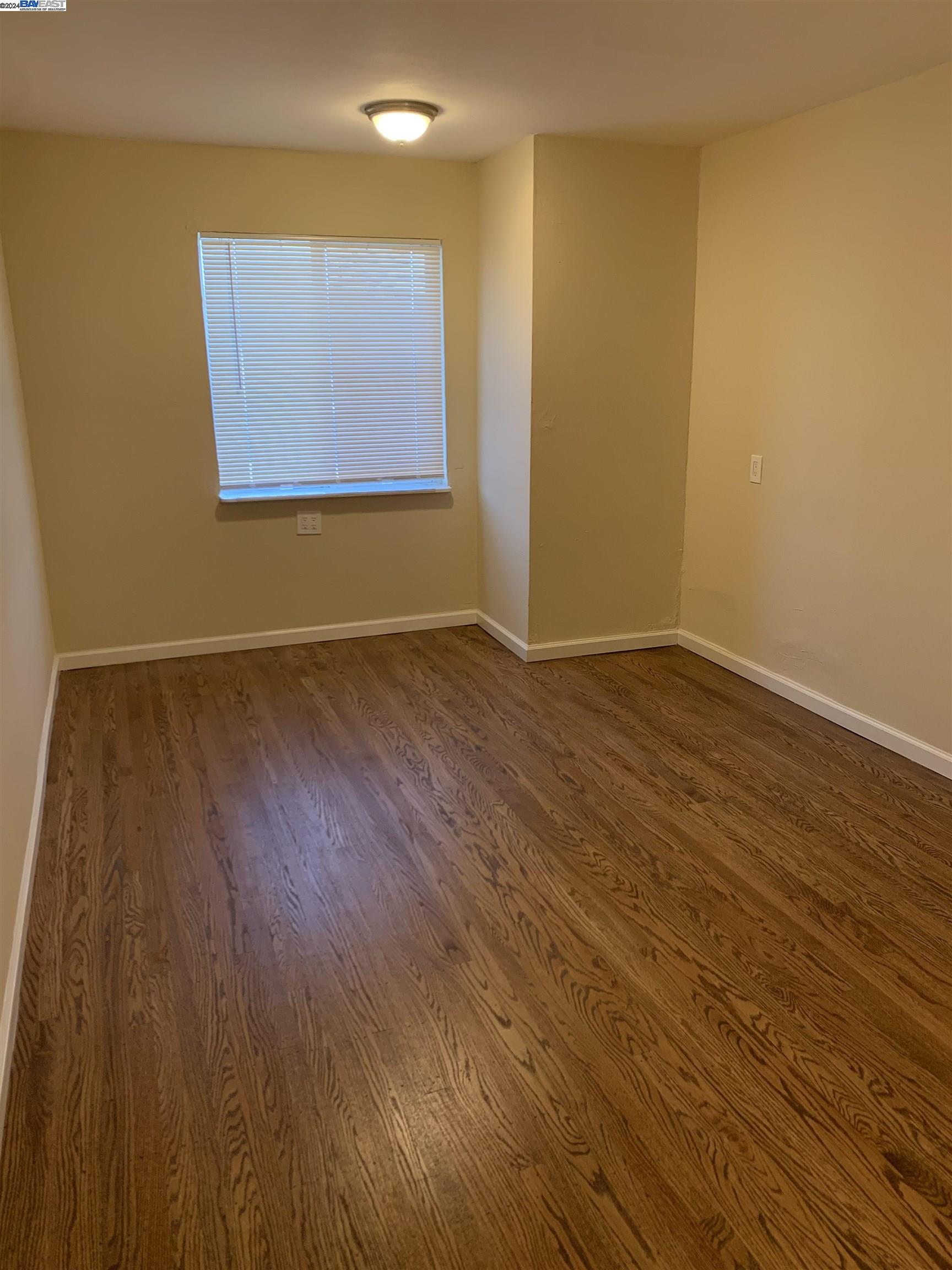 26730 Tyrrell Avenue Hayward, CA 94544 - Photo 10 of 26 a view of an empty room with wooden floor