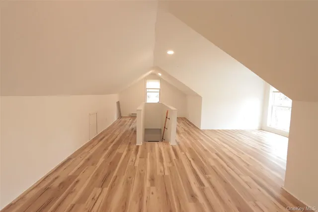 a view of wooden floor and brick walls
