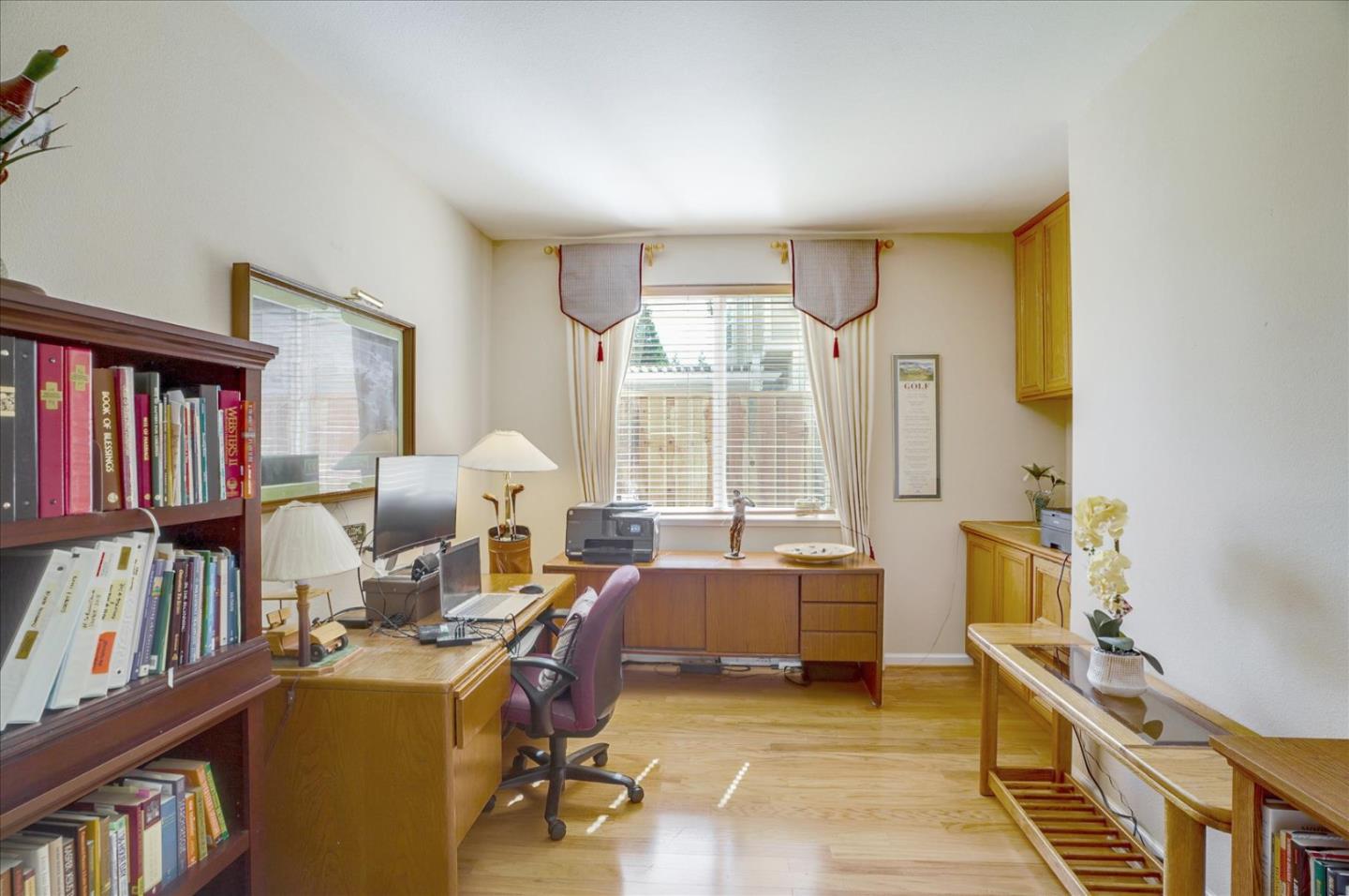 17686 Bentley Drive Morgan Hill, CA 95037 - Photo 13 of 30 a bed room with furniture and a book shelf
