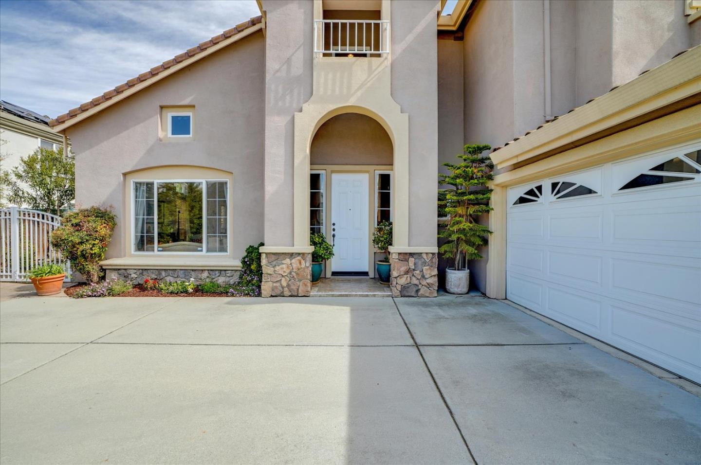 17686 Bentley Drive Morgan Hill, CA 95037 - Photo 3 of 30 a front view of a house with lots of windows and plants