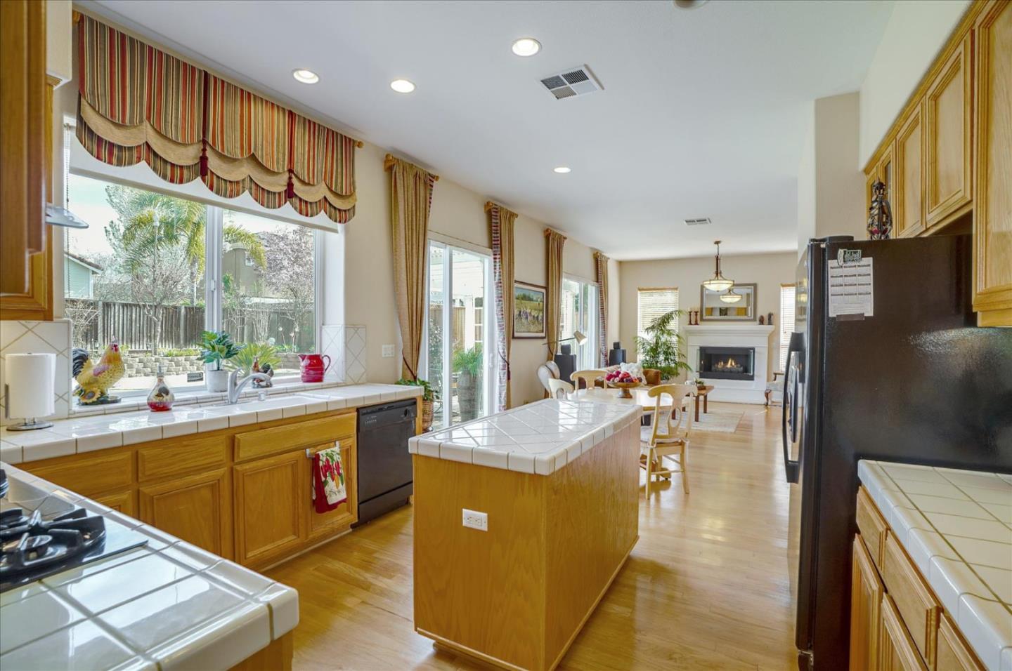 17686 Bentley Drive Morgan Hill, CA 95037 - Photo 8 of 30 a kitchen with counter top space a sink appliances and cabinets