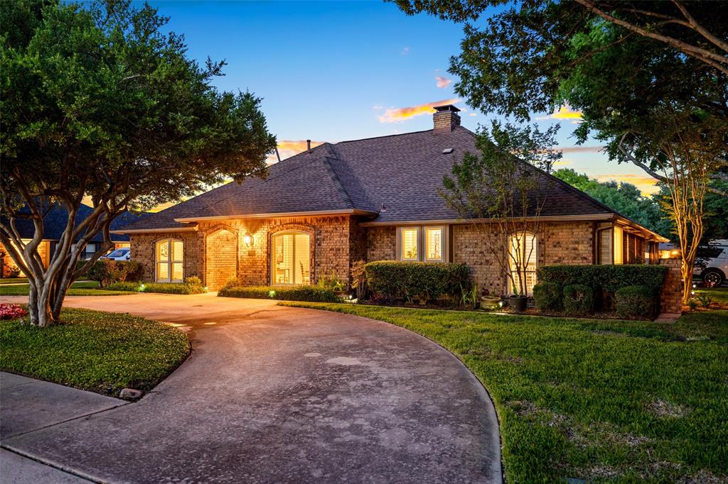 400 Hunters Ridge Circle Coppell, TX 75019 - Photo 29 of 35 a view of a house with a yard