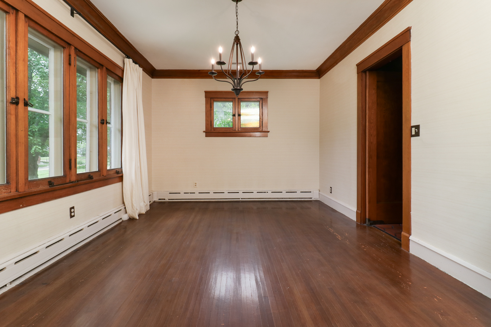 4 Clinton Place Normal, IL 61761 - Photo 11 of 38 a view of an empty room with wooden floor and a window