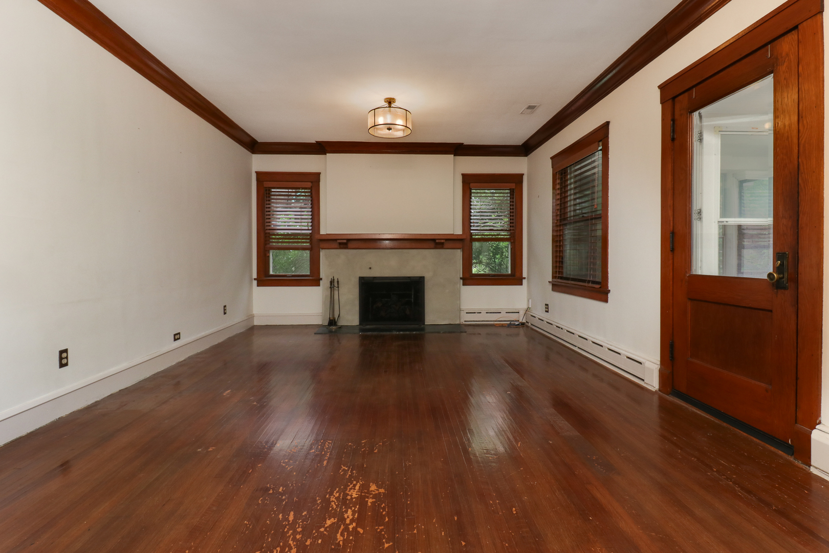 4 Clinton Place Normal, IL 61761 - Photo 13 of 38 an empty room with wooden floor and a window