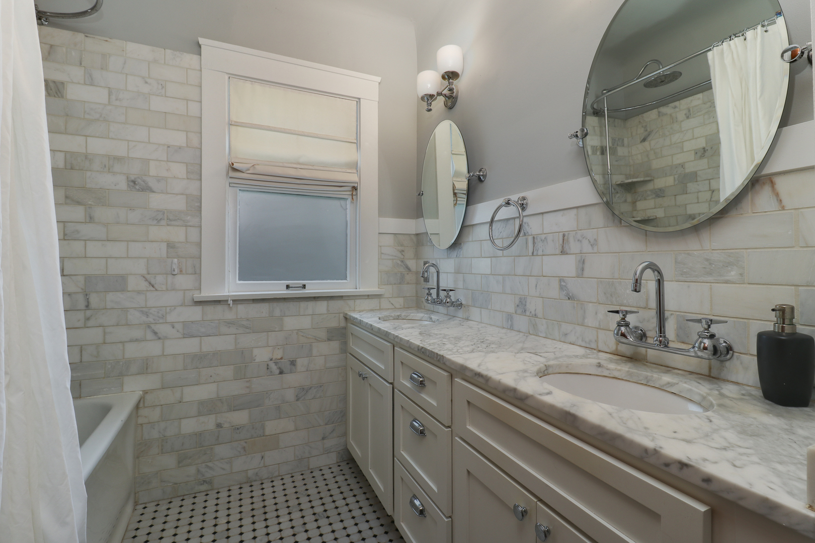4 Clinton Place Normal, IL 61761 - Photo 16 of 38 a bathroom with a sink and a mirror