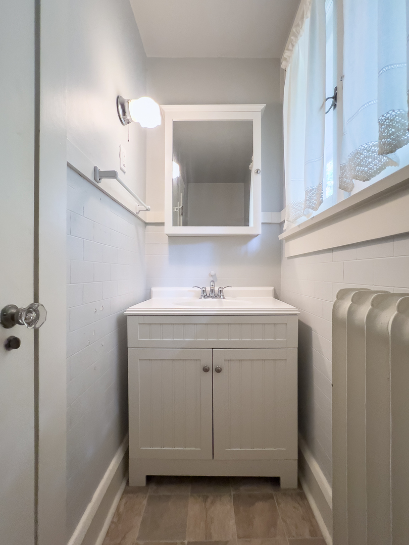 4 Clinton Place Normal, IL 61761 - Photo 22 of 38 a bathroom with a sink vanity and mirror