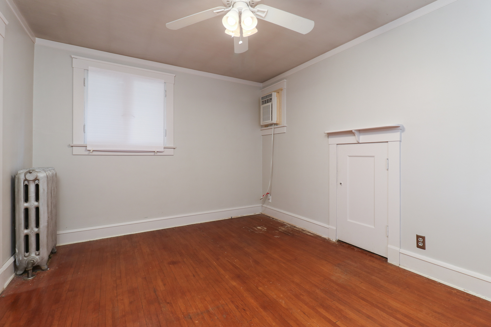 4 Clinton Place Normal, IL 61761 - Photo 24 of 38 wooden floor in an empty room with a window
