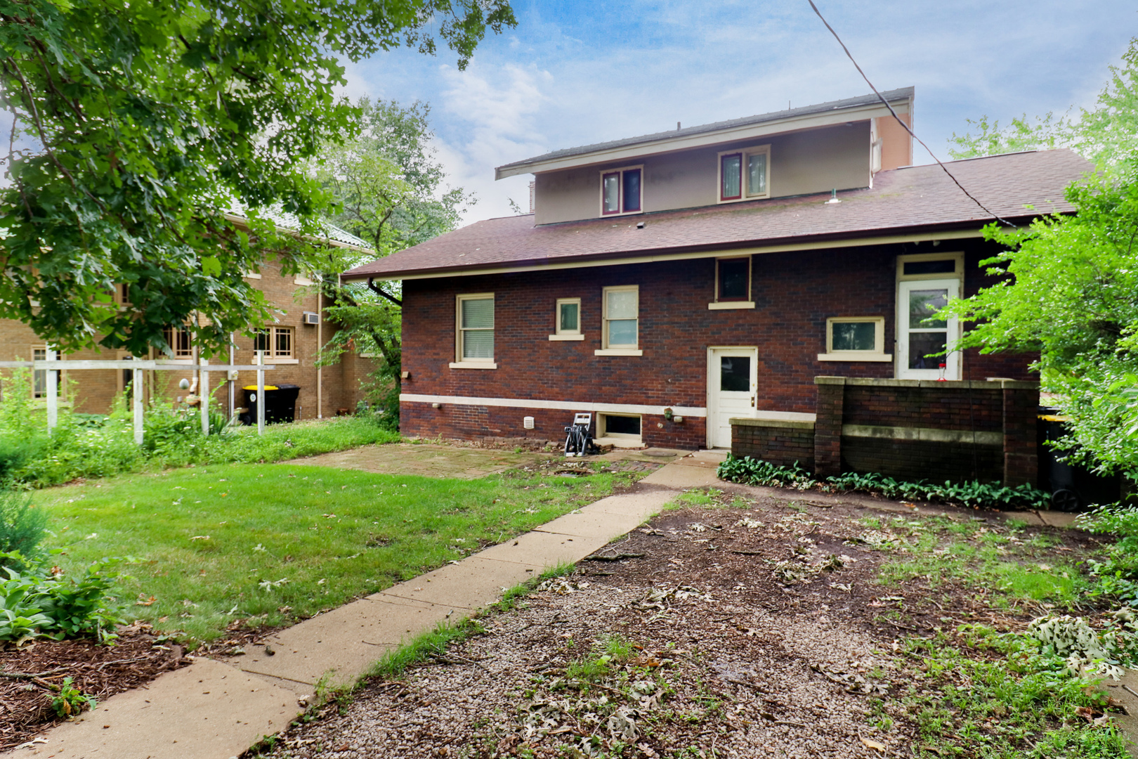 4 Clinton Place Normal, IL 61761 - Photo 32 of 38 a front view of a house with a yard and garage