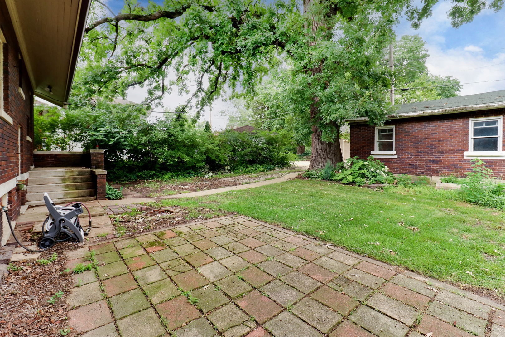 4 Clinton Place Normal, IL 61761 - Photo 34 of 38 a view of backyard with barbeque grill and potted plants