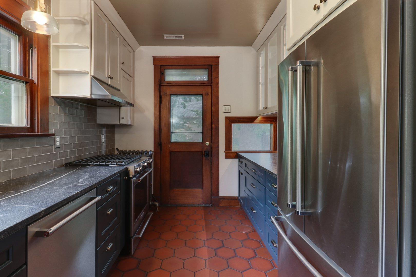 4 Clinton Place Normal, IL 61761 - Photo 5 of 38 a kitchen with stainless steel appliances granite countertop a refrigerator and a sink