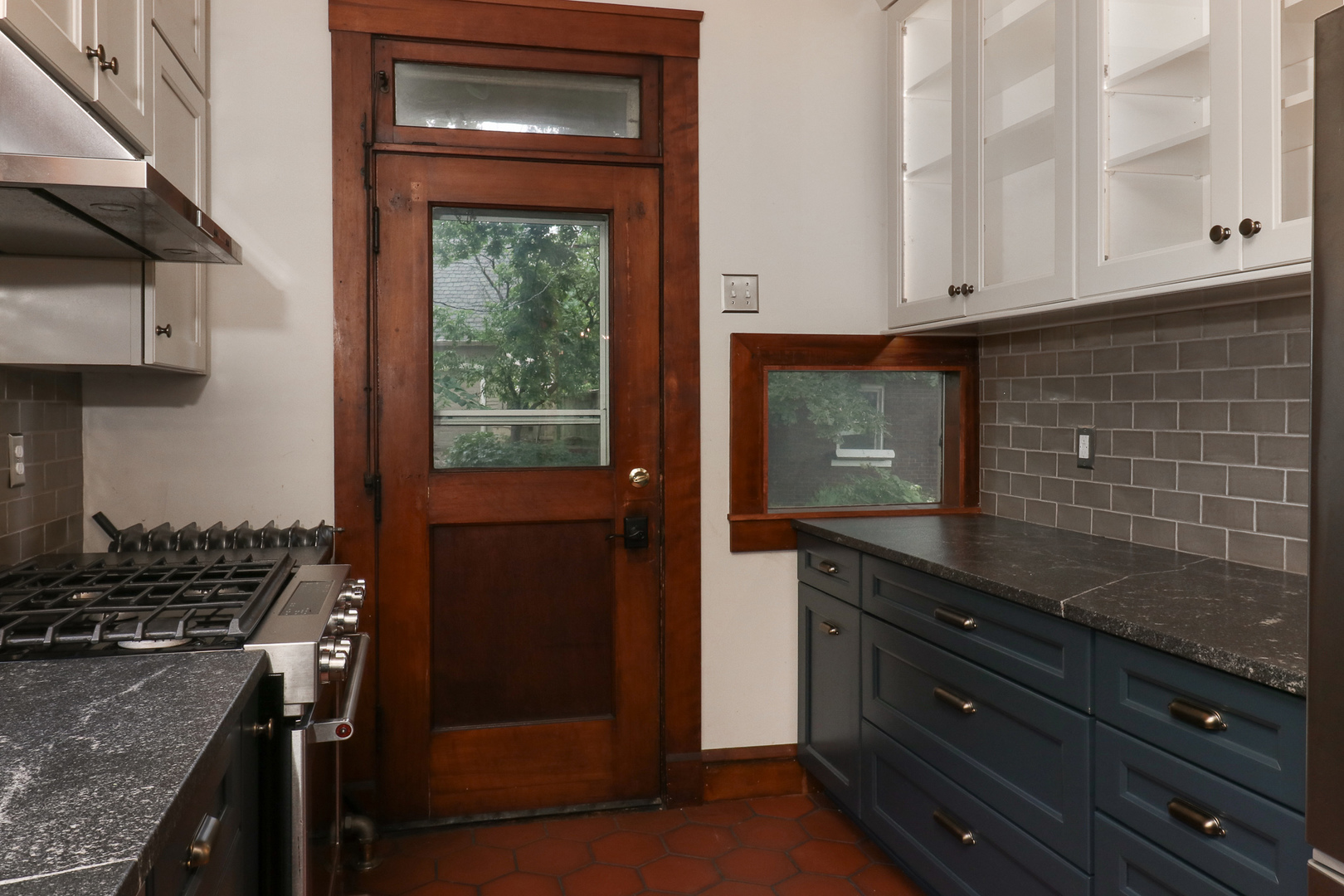 4 Clinton Place Normal, IL 61761 - Photo 9 of 38 a kitchen with granite countertop white cabinets and black appliances