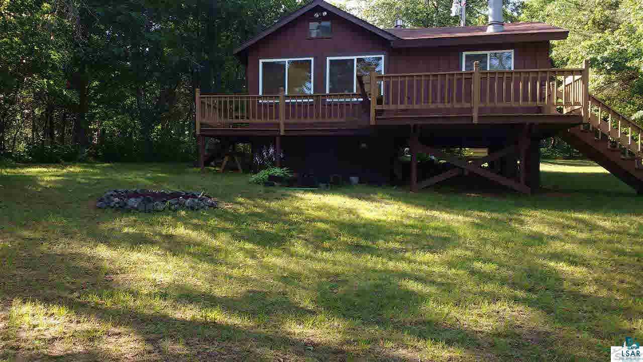 6876 East Boop Road Gordon, WI 54838 - Photo 8 of 13 Lake level side yard view. Look at this elevation. Not hard to access the lake here.