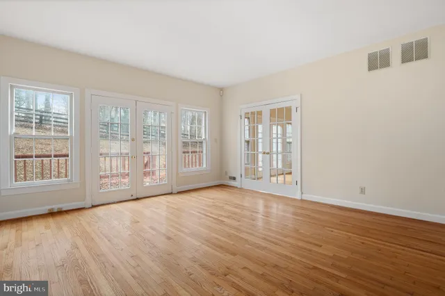 a kitchen with stainless steel appliances granite countertop a refrigerator stove microwave and sink