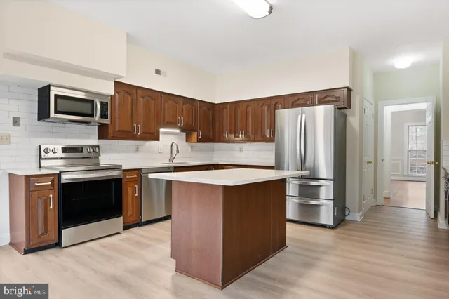 an empty room with a fireplace